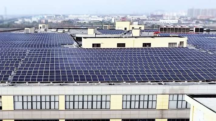 Sun-Rain solar photovoltaic system panoramic view with 2300 panels covering 12000 square meters on factory rooftop.