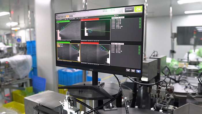 Atomization angle detection machine on automated production line for spray pump quality assurance and spray pattern testing